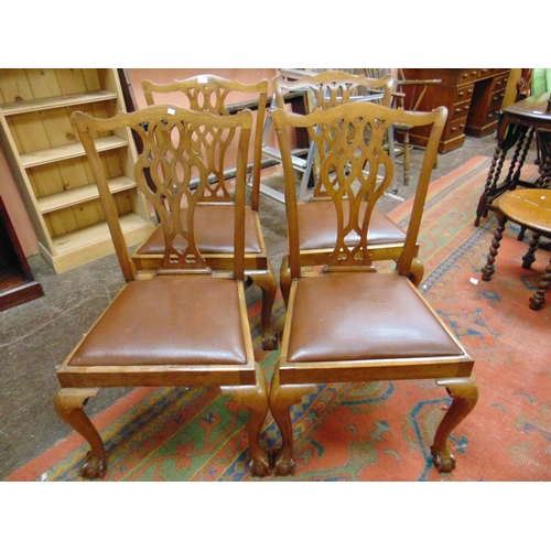 355 - Set of four Chippendale influenced dining chairs, pierced splat backs, drop in seats, on frontal cab... 