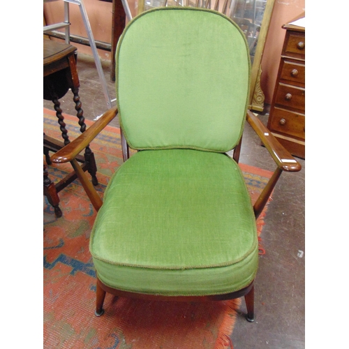 360 - An Ercol lounge chair, having cushion back and seat, with open arms, turned supports.