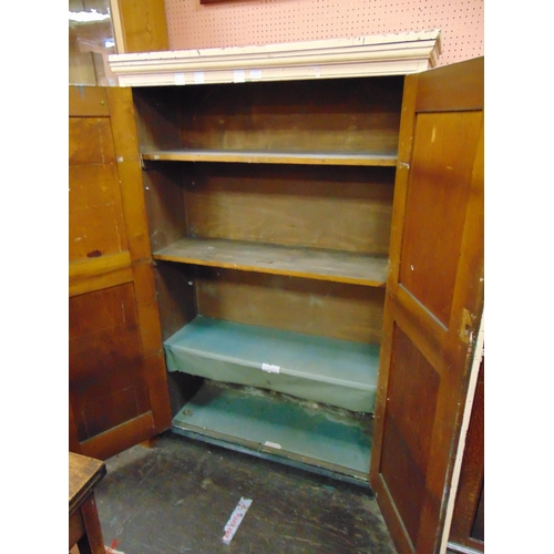 372 - Painted pine cupboard, ogive cornice above pair of panel doors, enclosing a shelf lined interior.  6... 