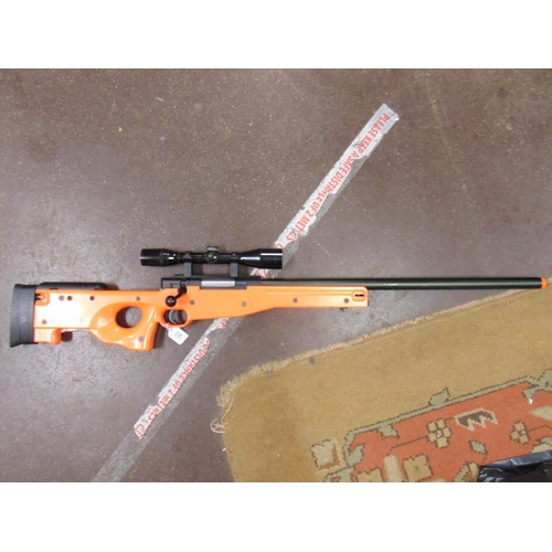 38 - Gas powered air soft rifle with scope. Please note: Purchasers must be over 18 and photographic ID m... 