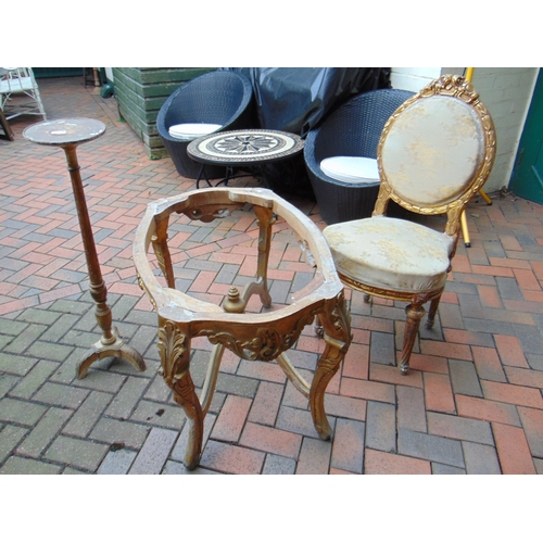 444 - Gilt painted torchere stand, gilt table frame and a chair.