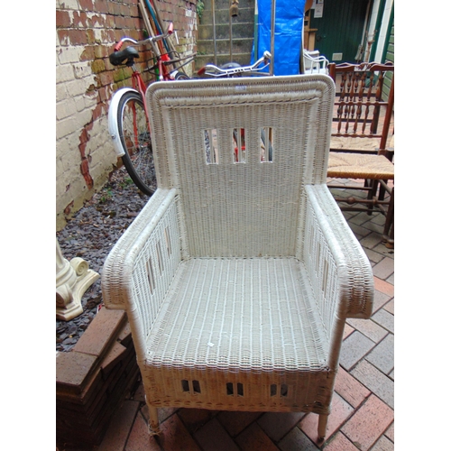 450 - Stout form painted wicker garden chair.