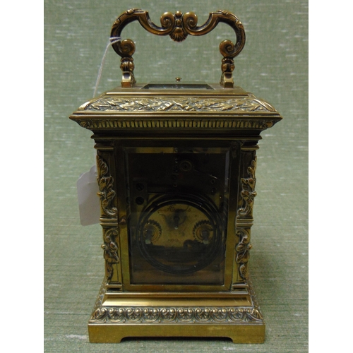 71 - Ornate French brass cased carriage clock, having moulded decoration, enamel face and Roman numerals.... 