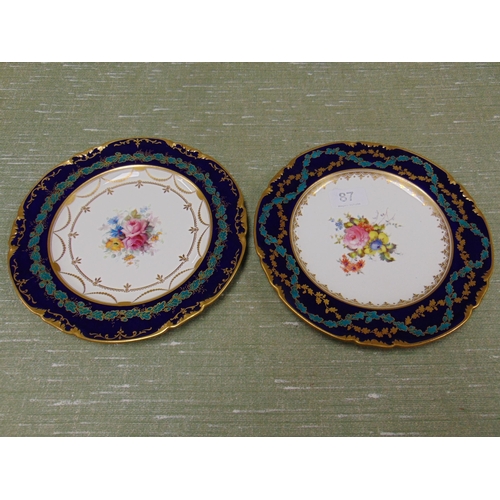 87 - Two Royal Crown Derby hand painted plates, having gilt oak leaf decoration.