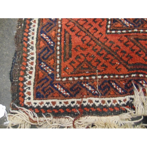 97 - Red ground Persian rug, having geometric pattern. 69 x 38