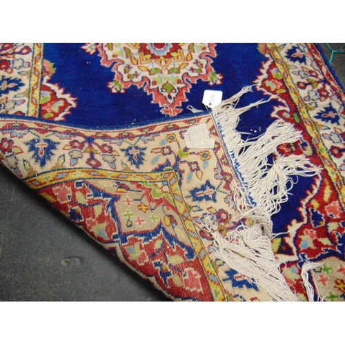 98 - Small blue ground floral fug, having stylized border, 58 x 27