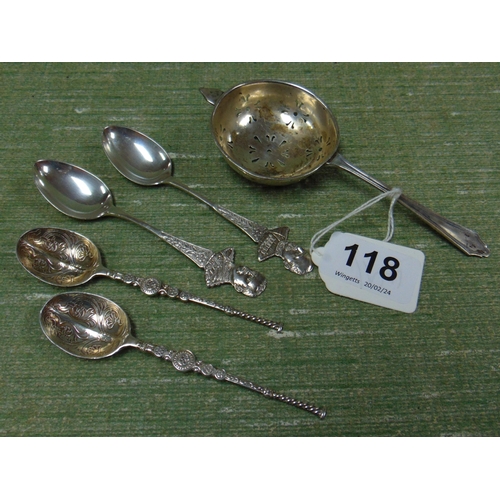 118 - Silver tea strainer and two pairs of silver spoons.