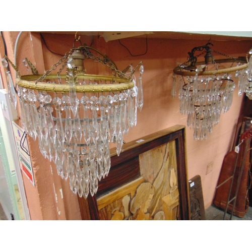 124 - Pair of gilt metal light fittings, having glass droplet decoration.