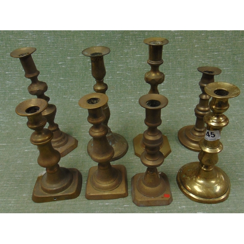 145 - Quantity of brass candlesticks.