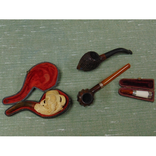 175 - Meerschaum pipe, cheroot holder, hedgehog pipe and an amber coloured pipe.