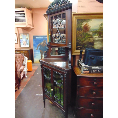 382 - 19th century ornate mahogany corner cupboard, ornate pierced urn form cornice, above beaded glazed d... 