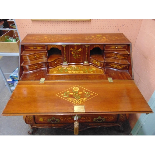 388 - Dutch marquetry inlaid bombe shaped bureau, profussley decorated all over, having a fall front revea... 