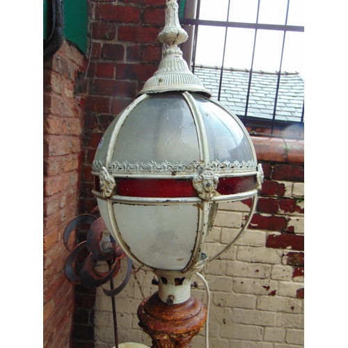 412 - Good antique cast iron free standing lamp, having glazed sphere mount, and moulded decoration, 82