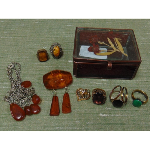 102 - Three rings and a pendant, and some other jewellery.