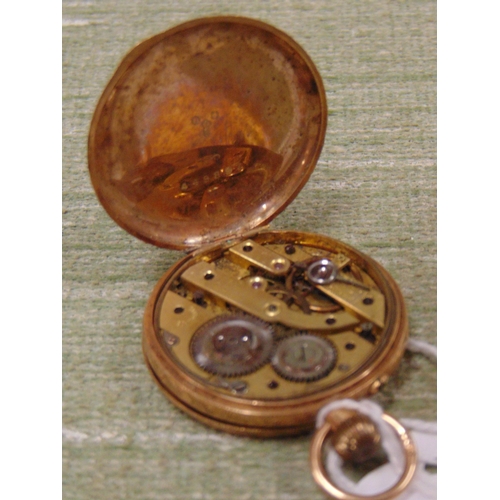 166 - Possibly gold cased fob watch, having engraved decoration.