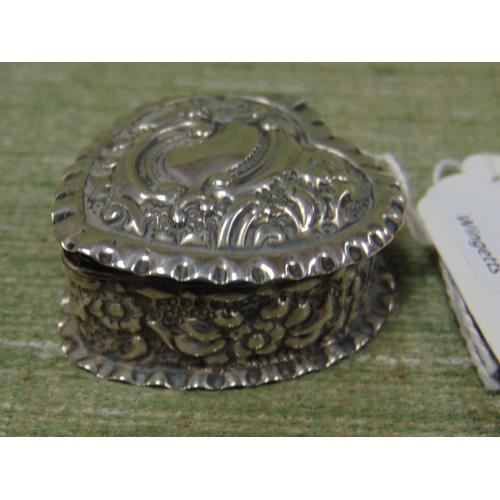 172 - Silver heart shaped pill box, having embossed decoration, maker WHW, Birmingham 1899.