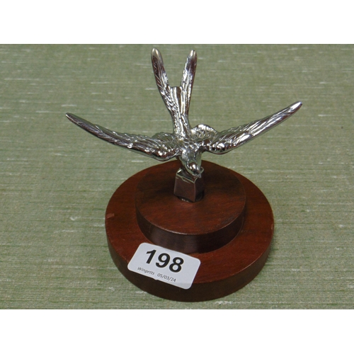 198 - Bird form car mascot, set on a circular wooden base, 5.5