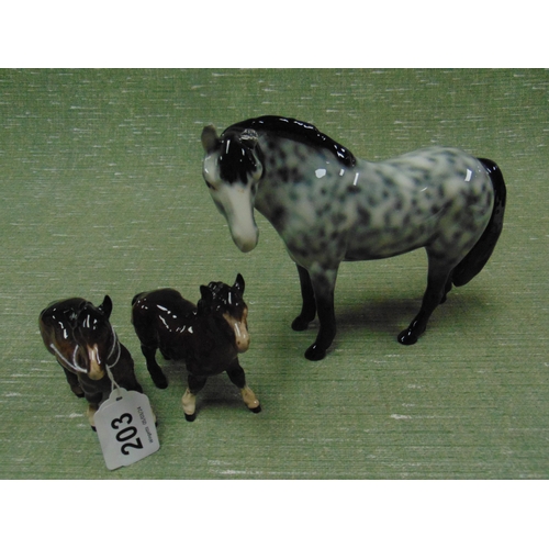 203 - Two Beswick horses (f) and one other example. (3)