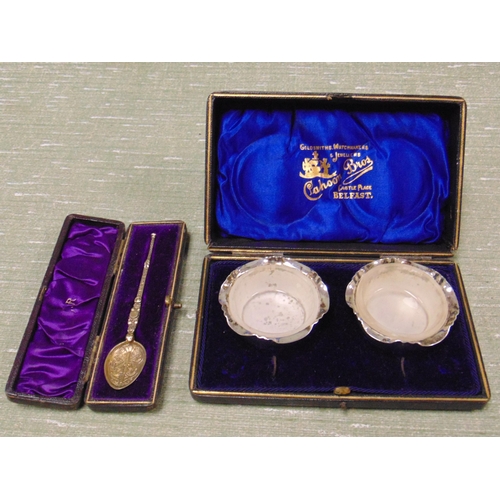 21 - Cased pair of plated salts and a cased anointing spoon.