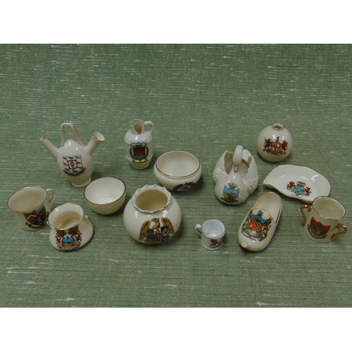 213 - Small quantity of crested commemorative china miniatures.