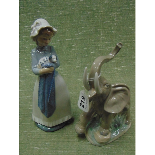 219 - Nao figure of an elephant and a lady holding a puppy dog. (2)