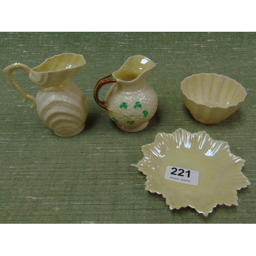 221 - Four pieces of Belleek shell form china.