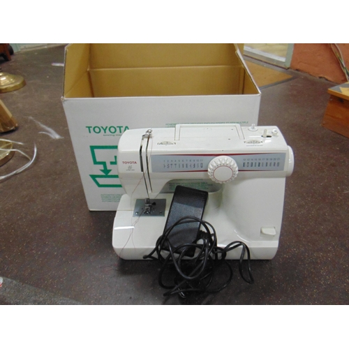 241 - Boxed Toyota sewing machine.