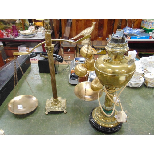 258 - Set of brass scales and an oil lamp (converted).