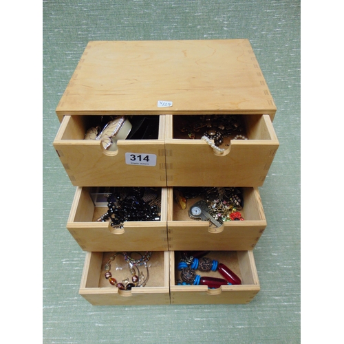 314 - Six drawer chest containing a quantity of costume jewellery.