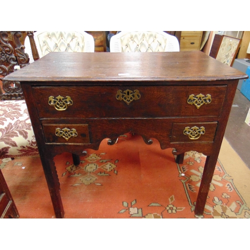 330 - Antique oak lowboy, rectangular top above single long drawer and two short with brass handles and es... 