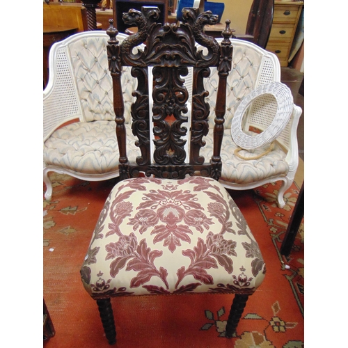 331 - An oak side chair, carved back, upholstered seat and on bobbin turned frontal supports.