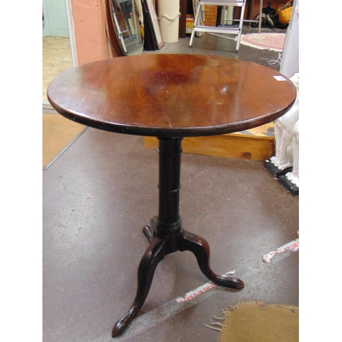 334 - Georgian mahogany tripod table, circular tilt top, gun barrel base and on down swept supports. 28