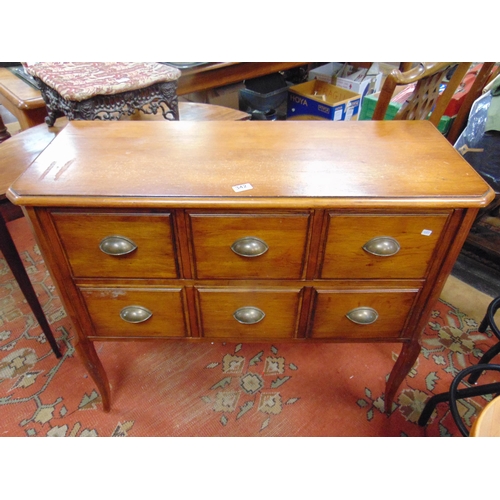 342 - Reproduction six drawer side cabinet, having canted corners and on frontal cabriole supports. 33 x 3... 