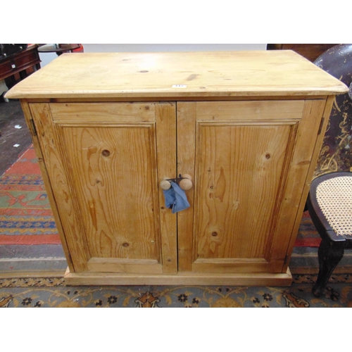 347 - Pine double door cupboard, having knob handles.  32 x 35 x 19