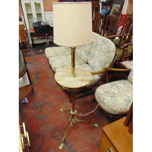 362 - Shaped brass and onyx standard lamp.