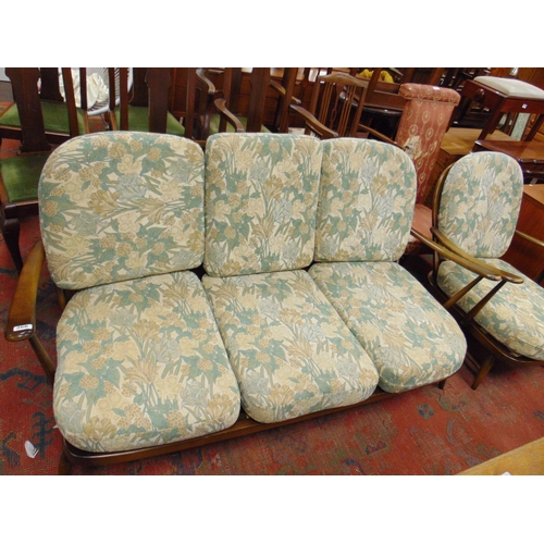 366 - An Ercol three seater settee and matching single chair.