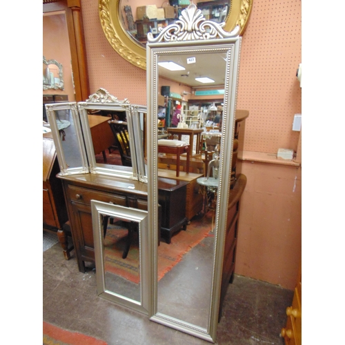 423 - Modern silver coloured rectangular wall mirror, and two other examples.