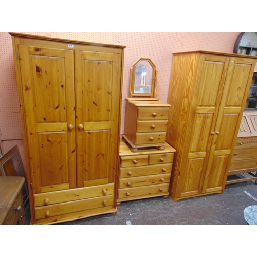 424 - Modern pine bedroom suite, comprising two double door wardrobes, chest of drawers, bedside chest and... 