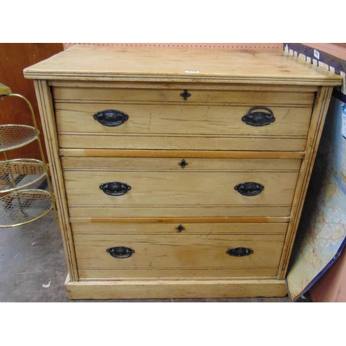 429 - Edwardian pine chest of three long drawers with metal handles  and on platform base.  34 x 33.5 x 20... 