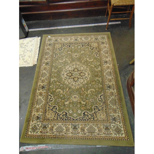 445 - Indian green ground rug, 67 x 47