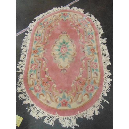 448 - Chinese oval pink and floral carpet, 60 x 36