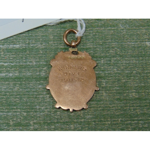 454 - 9ct gold pendant , commemorating the Glamorgan Football League, winners Div 1 1911-12.  7 gms.