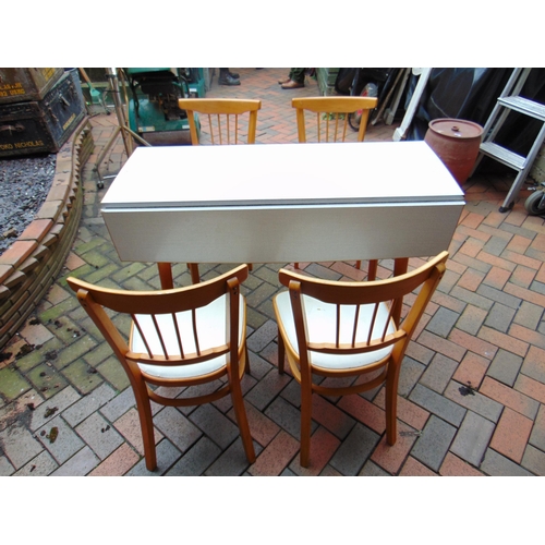 476 - Retro drop leaf kitchen table and four stick back chairs.