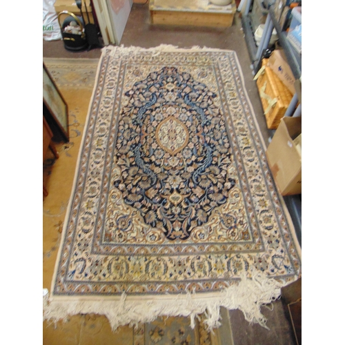 515 - Good Persian blue and fawn ground rug, having geometric floral pattern. 86 x 50