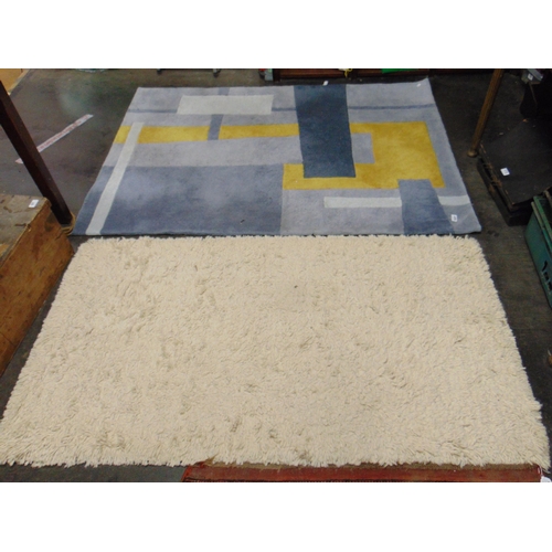 Two modern rugs, retailed by Dunelm.