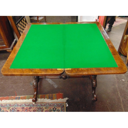 327 - Victorian inlaid walnut games table, fold over top revealing a baize lined interior, set on turned s... 