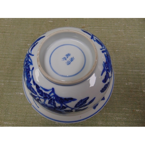 146 - Antique oriental blue and white bowl, decorated with bird flying above mushrooms, having four charac... 