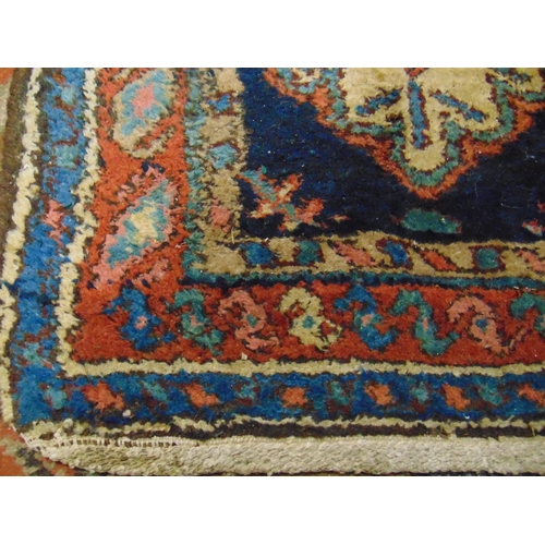 22 - Persian red and blue ground rug, having geometric pattern, 92 x 37