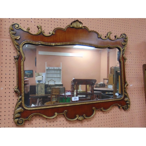 29 - Antique continental wall mirror, of shaped form and having gilt highlights, 23 x 29