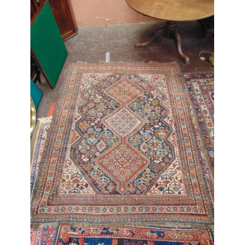 35 - Persian red and blue ground rug, having geometric pattern, 76 x 50